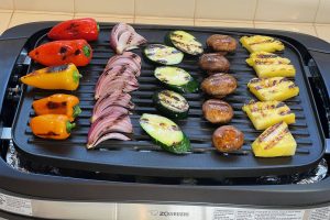grilled vegetables lined up on electric grill