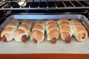 row of baked hot dogs