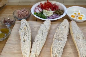 ingredients for Pan Bagnat sandwich and plain French baguette