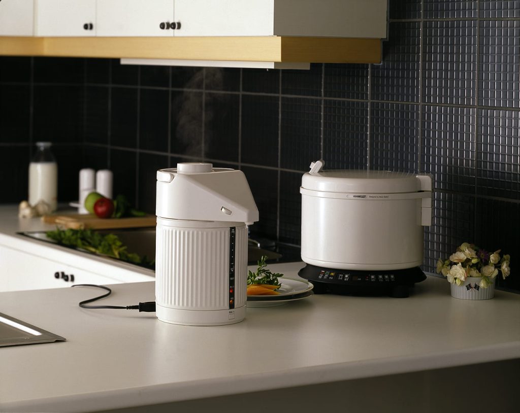 Pot and Rice cooker on a white kitchen counter top