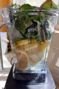 green smoothie ingredients in blender