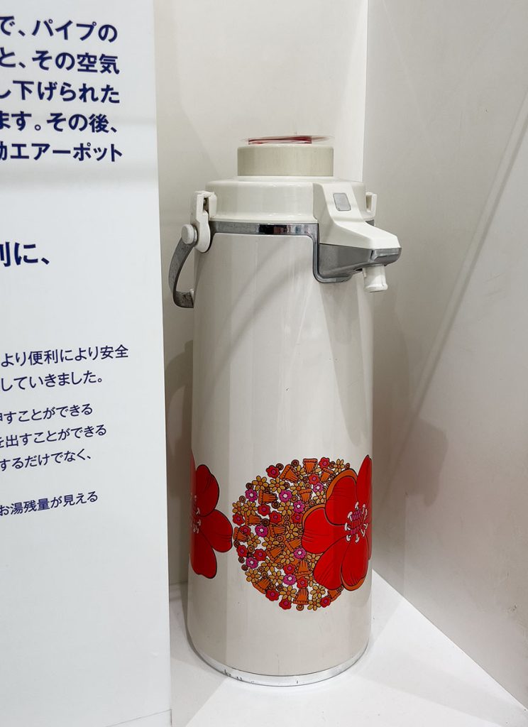 A vintage model with a bright floral design is displayed at Zojirushi's Museum 