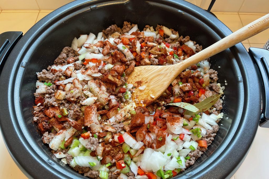 chili ingredients being prepped in skillet