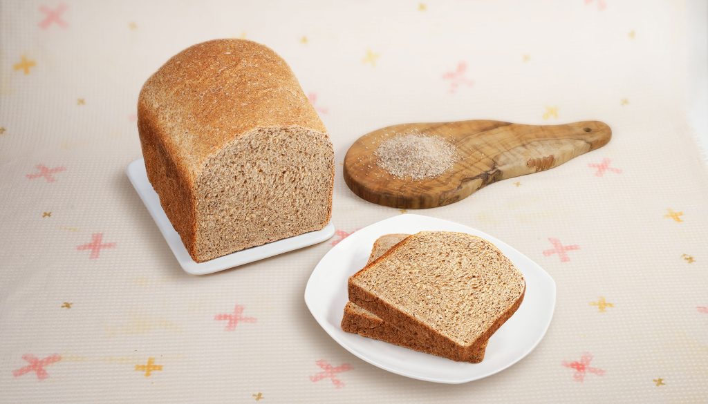 7 grain bread loaf and 2 slices